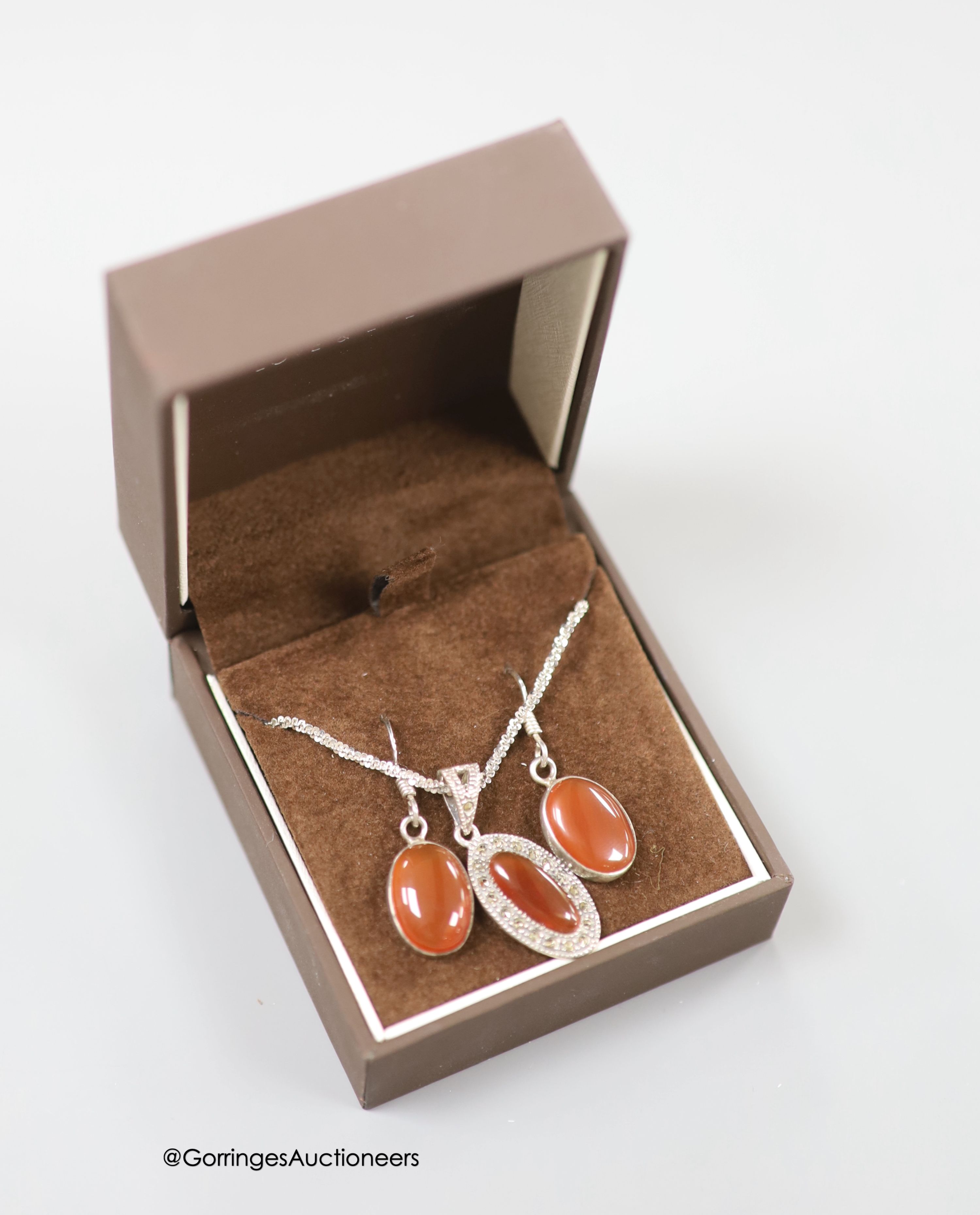 A 925, chalcedony and marcasite set necklace and a pair of similar earrings.